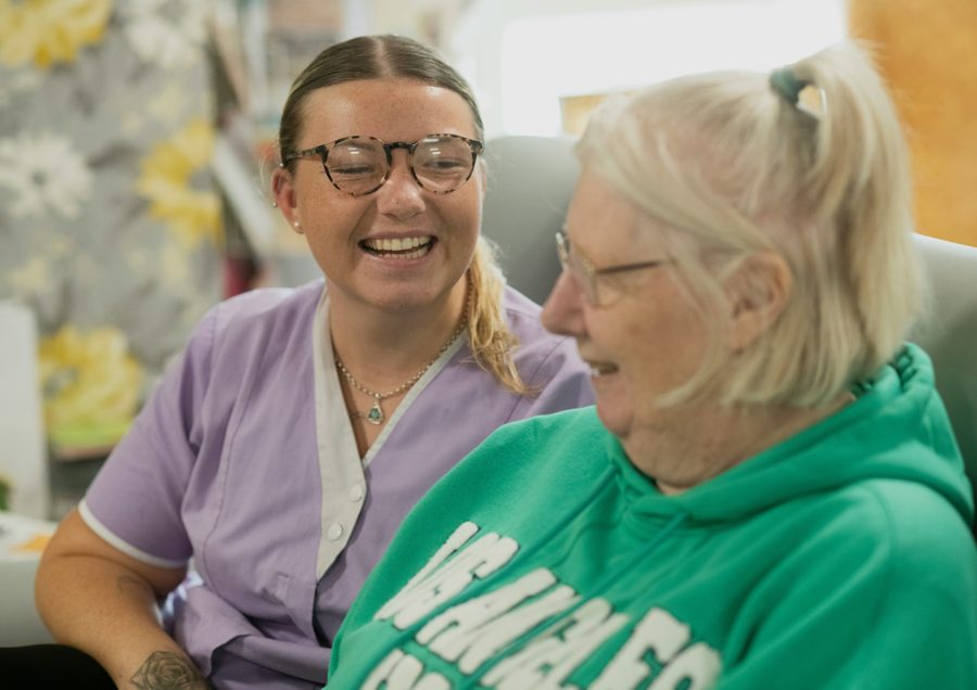 Two people having a warm, supportive conversation